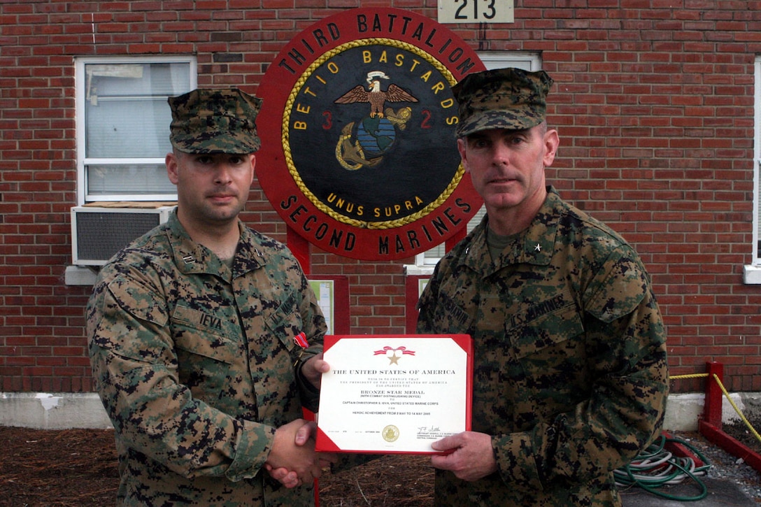 MARINE CORPS BASE CAMP LEJEUNE, N.C. (Nov. 15, 2005)- Capt. Christopher S. Ieva, a North Brunswick, N.J., native receives a Bronze Star Medal from BGen. Joseph J. McMenamin, the assistant division commander. Ieva received the award for his actions as Commanding Officer of Company K, 3rd Battalion, 2nd Marine Regiment, Regimental Combat Team-2, 2nd Marine Division during Operation Iraqi Freedom. (Official U.S. Marine Corps photo by Lance Cpl. Lucian Friel (RELEASED)