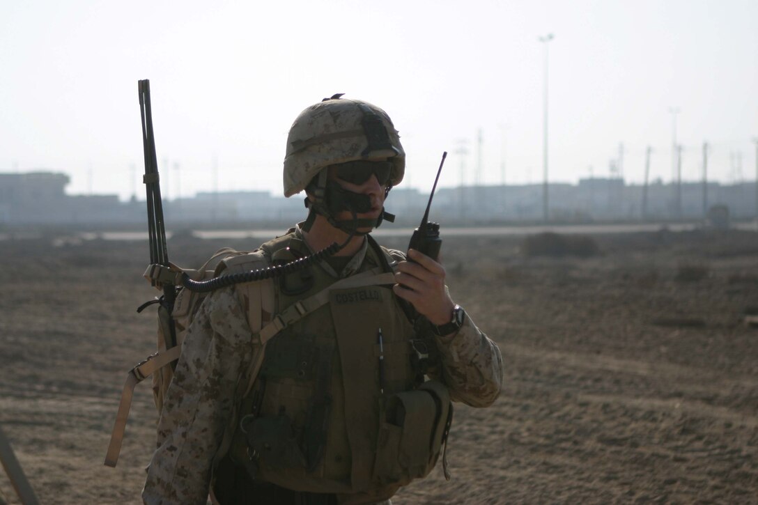 RAMADI, Iraq - Captain John M. Costello, a U.S. military advisor for 1st Battalion, 1st Brigade of the 7th Iraqi Army Division patrols the streets of Tammim here Dec 15. The Iraqi soldiers accompanied by their U.S. military advisors provided a presence on the streets during Al Anbars provincial elections. Official U.S. Marine Corps photo by Sgt. Ryan S. Scranton