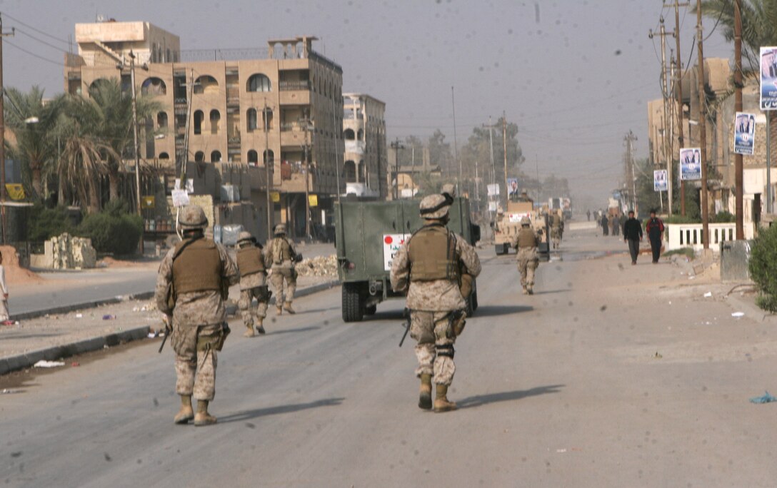 Marines of 6th Civil Affairs Group, 2nd Marine Division conduct foot patrols through their area of the city during the National Election Dec. 15.
