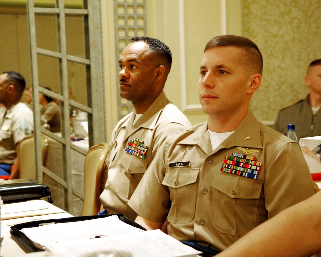 LAS VEGAS ? Major Donald B. Moor, assistant aviation officer procurement officer, 4th Marine Corps Recruiting District, listens attentively during a class about what is expected of officer candidates attending The Basic School. The Basic School is a follow-on course for Marine officers who graduate from Officer Candidate School. The course teaches Marine officers basic infantry skills. More than 100 Marines gathered for the fiscal year 2006 Officer Selection Officer Conference, held Dec. 12 ?15, in Las Vegas.