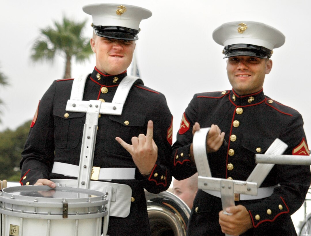 Cpl. Michael Thorson, left, and Lance Cpl. Jarod Butts psyche up for a drumline performance.