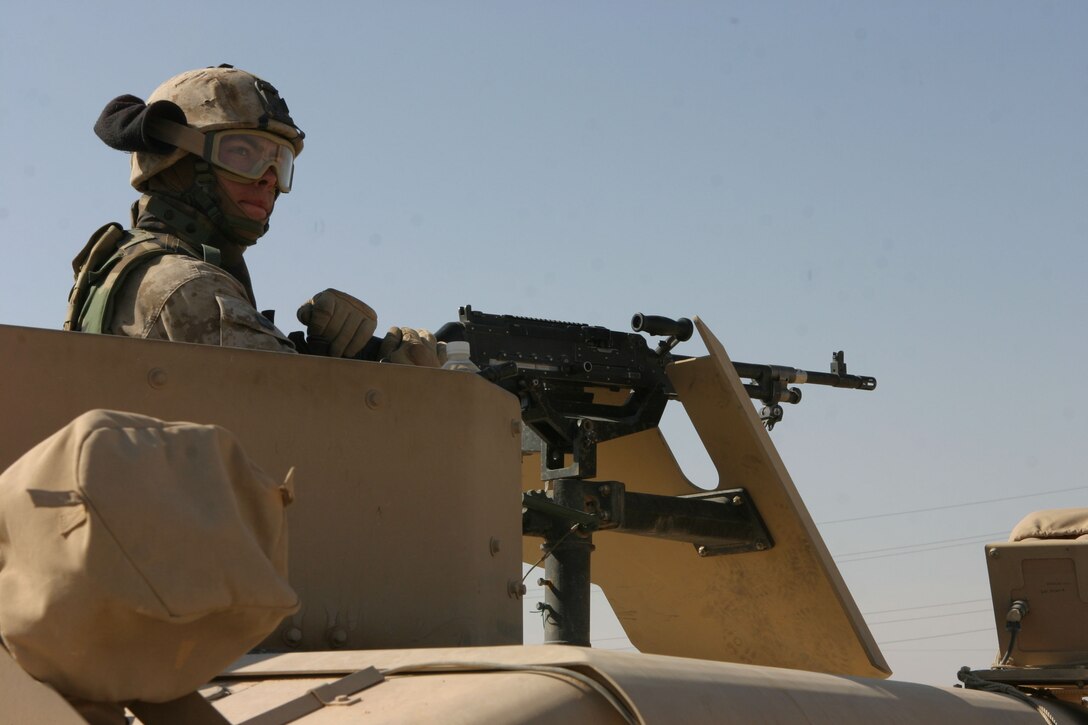 AL UBAYDI, Iraq (April 27, 2005)- Lance Cpl. Montgomery, a combat engineer with Company A, 4th Combat Engineers Battalion supporting 3rd Battalion, 2nd Marine Regiment, Regimental Combat Team-2, provides security during a school assessment here. The Marines of Task Force 3/2 discovered a lack of school supplies and some structural problems during their visit. Offical U.S. Marine Corps photo by Lance Cpl. Lucian Friel (RELEASED)