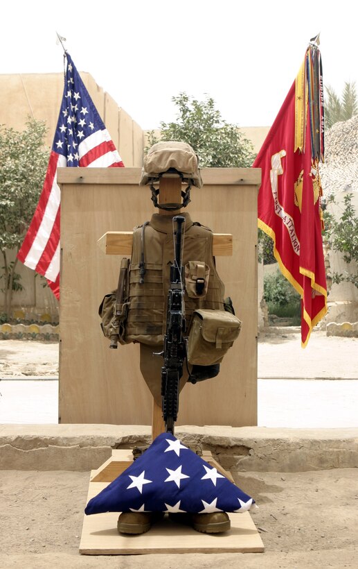 FALLUJAH, Iraq - Pfc. Joshua Klinger's gear display rests in a courtyard at Company B, 1st Battalion, 6th Marine Regiment's base of operations here June 16.  The 21-year-old North Hampton, Penn. native passed away June 14 when an improvised explosive device detonated near his position while patrolling Fallujah's streets.