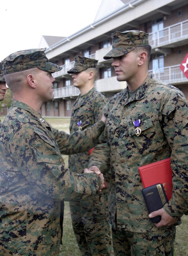 MARINE CORPS BASE CAMP LEJEUNE, N.C. - Lance Cpl. Josh Barrett, an infantryman with Surveillance, Target and Acquisition Platoon, Weapons Company, 1st Battalion, 6th Marine Regiment, is presented his Purple Heart Medal here Nov 16.  The 25-year-old Memphis, Tenn. native was awarded this medal for injuries sustained after a roadside bomb detonated near his vehicle while he and his teammates had been conducting security and stability operations outside Fallujah, Iraq this summer.