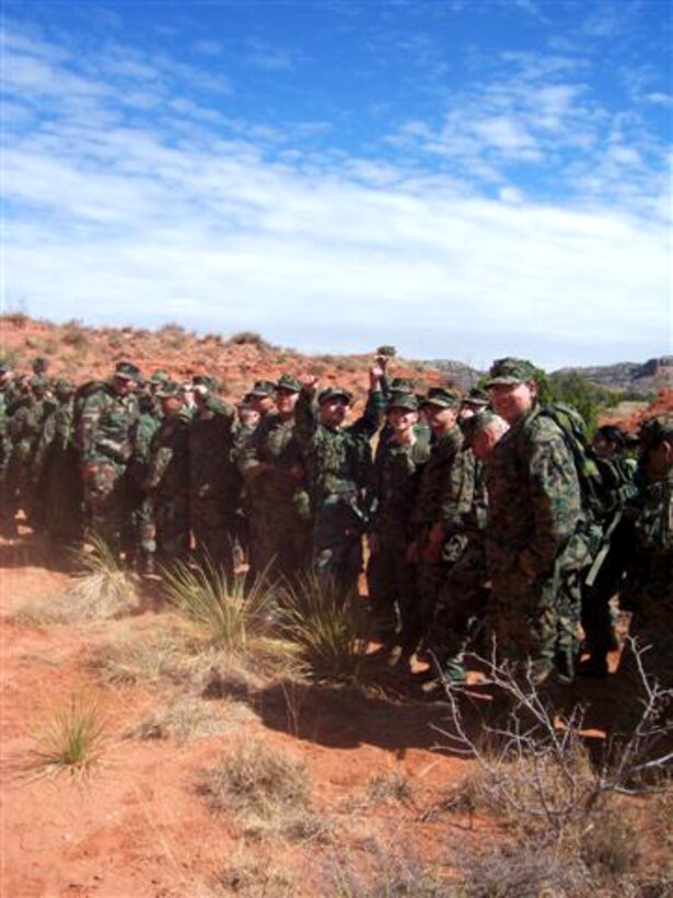 During a break on the hike, cadets urge the rest of 1st Herd Battalion to continue with the march on the Lighthouse Trail in Palo Duro State Park April 7.