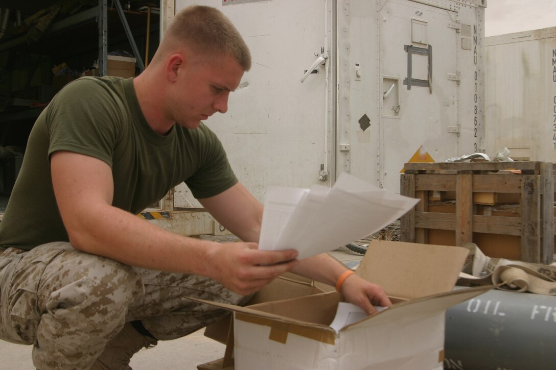 AL ASAD, Iraq ? Lance Cpl. Jeffrey Brock an aviation supply specialist with Marine Aviation Logistics Squadron 26 packs gear into a box headed for one of the 2nd Marine Aircraft Wing?s forward operating bases, May 17. The MALS-26 Supply division works closely with the ?Patriots? operations and maintenance division to get aircraft parts to all of the forward operating bases to increase readiness of all of the flying squadrons they work with.