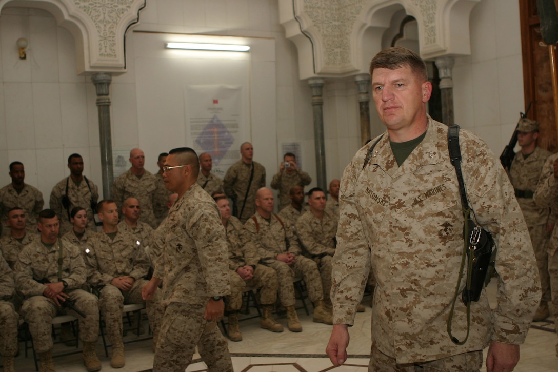 Major Gen. Richard F. Natonski, 1st Marine Division commanding General marches off deck in the Transfer of Authority ceremony with Maj. Gen. Richard A. Huck, 2d Marine Division commanding general, March 17.  Natonski relinquished authority of operations in the Al Anbar Province to Huck during the ceremony.  U.S. Marine Corps photo by Sgt. Stephen D'Alessio (RELEASED)