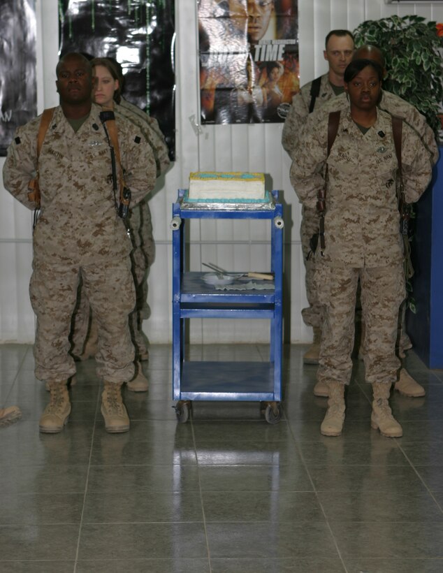 Four Sailors escort the birthday cake for the Navy's Hospital Corps 107th birthday  during a ceremony held here June 17 to honor the most decorated job field in naval history.