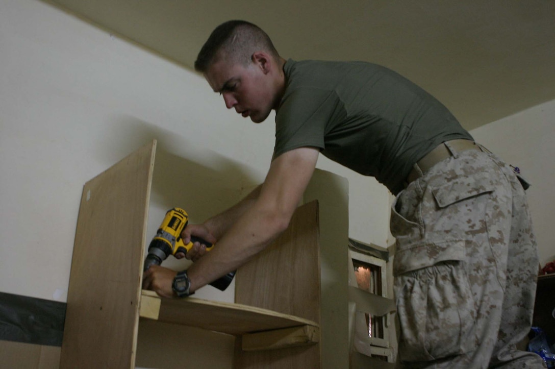 LCpl. Shane P. Costello, provisional infantryman, 2nd squad, 2nd platoon, Kilo Battery, 3rd Battalion, 10th Marines, 2d Light Armored Reconnaissance Battalion, Regimental Combat Team-2, works on the border of Iraq and Syria to help maintain the security of the country.  While not providing securtiy or working at the main gate Costello works to improve the Foward Operating Base.  (Photo by LCpl. Zachary W. Lester)