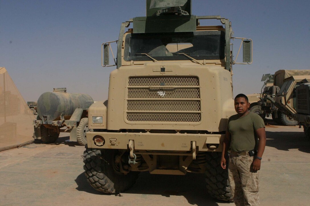 Lance Cpl. Silvio J. Davilaruiz, motor transport operator, Headquarters and Support Company, 2nd Light Armored Reconnaissance Battalion, Regimental Combat Team-2, drives a 7-ton truck on various types of operations in western Iraq while deployed in support of Operation Iraqi Freedom. (Photo by LCpl. Zachary W. Lester)