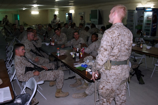 050917-M-8489S-002 AR RAMADI, Iraq (September 17, 2005) -Marines from 3rd Battalion, 7th Marine Regiment watch Seaman Apprentice Jeremy Trythall, a hospital-man apprentice here, give a class on the Individual First-Aid Kit and tourniquet system that has been issued to the Marines. Photo by Cpl. Shane Suzuki