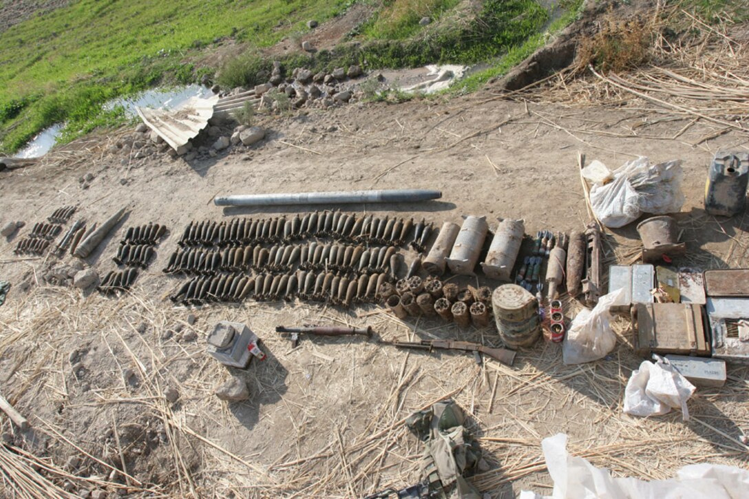 051117-M-2607O-001 - Marines from to Company F, 2nd Battalion, 2nd Marine Regiment, found a large cache of weapons and ammunition while searching a burm next to a canal during  Operation TRIFECTA on Nov 17.