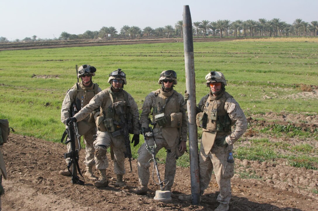 051117-M-2607O-003 - Engineers stand tall with their even taller rocket discovered next to a small canal while conducting cache sweeps during Operation TRIFECTA on Nov 17.