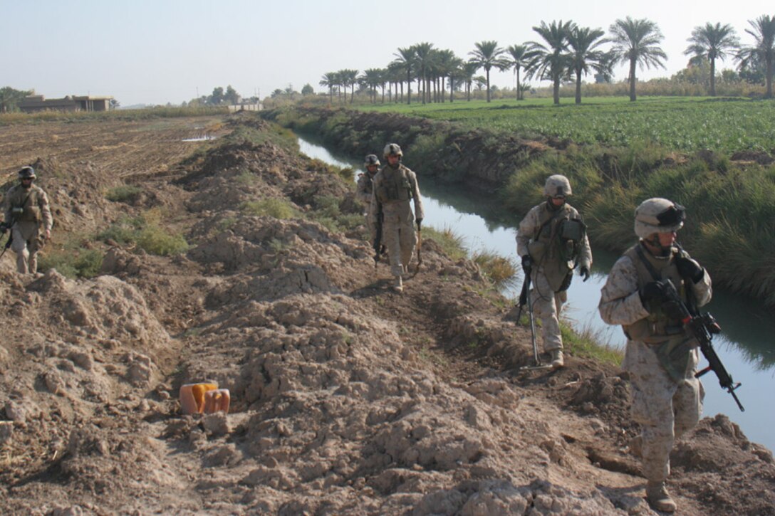 051117-M-2607O-005 - Engineers patrol along a canal while conducting cache sweeps of a burm during Operation TRIFECTA on Nov 17.