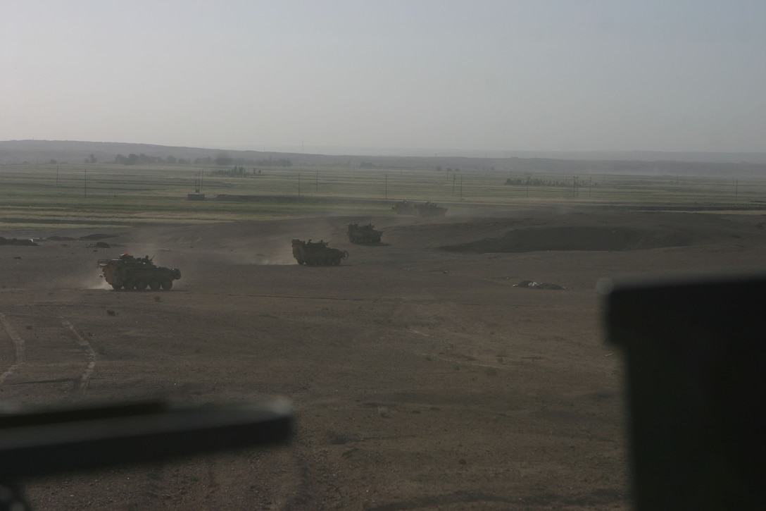 AL QAIM, Iraq (May 9, 2005)- Marines with Bravo Company, 2nd Light Armored Reconnasince Battalion, Regimental Combat Team-2 get into position during the first objective of Operation Matador here. They were the first Marines to cross the Euphraites River. Official U.S. Marine Corps photo by Lance Cpl. Lucian Friel