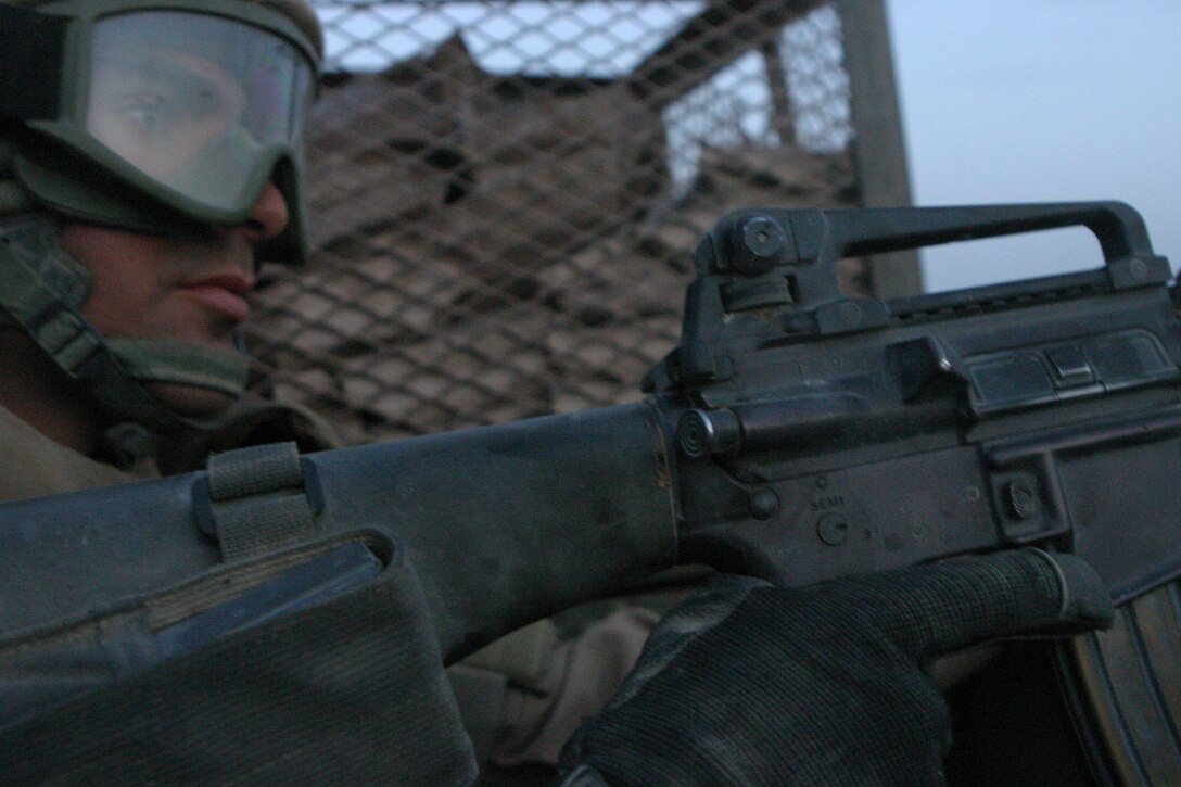 AL QAIM, Iraq (May 13, 2005)- Lance Cpl. Jason W. Thomas, an armoror with Bravo Company, 2nd Light Armored Reconnasince Battalion, Regimental Combat Team-2 scans the local terrain during Operation Matador here. Official U.S. Marine Corps photo by Lance Cpl. Lucian Friel