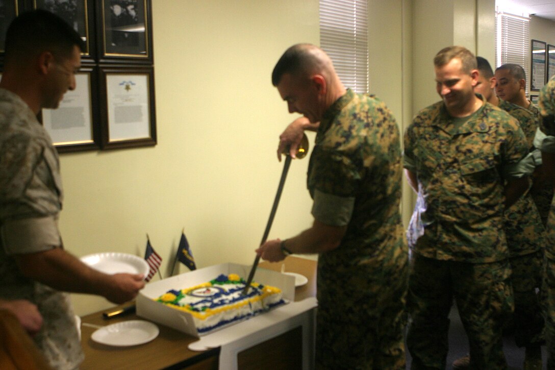 MARINE CORPS BASE CAMP LEJEUNE, N.C. (October 13, 2005) ? Over 100 sailors and their guests, including Brig. Gen. Joseph J. McMenamin, recognized the 230th birthday of the United States Navy in a cake-cutting ceremony Oct. 13 in the division surgeon?s office.