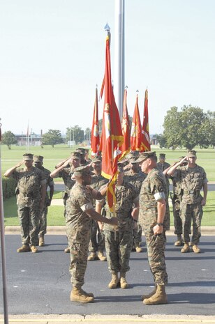 Brig. Gen. E.G. Payne, outgoing commanding general, passes the guidon to Maj. Gen. Willie L. Williams, incoming commanding general, in the Change of Command ceremony June 17.  WIlliams will command MCLB Albany Ga., MCLB Barstow, Calif and Blount Island Command, Jacksonville Fla.