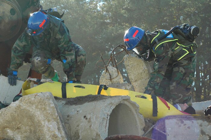 INDIAN HEAD, Md.-Medical personnel from the Chemical Biological Incident Response Force (CBIRF) rescue a survivor from a catastrophic collapse during a simulated high-yield explosive event at the Raymond M. Downey Sr. Training Facility Nov. 17.  According to HMC (SS) Michael E. Waters, the senior enlisted advisor and Independent Duty Corpsman (IDC)for the unit, "CBIRF medical has been integrated into rescue operations to provide quick on scene triage and medical stabilization during and after patient extrication.  This expedites care in a mass casualty situation.