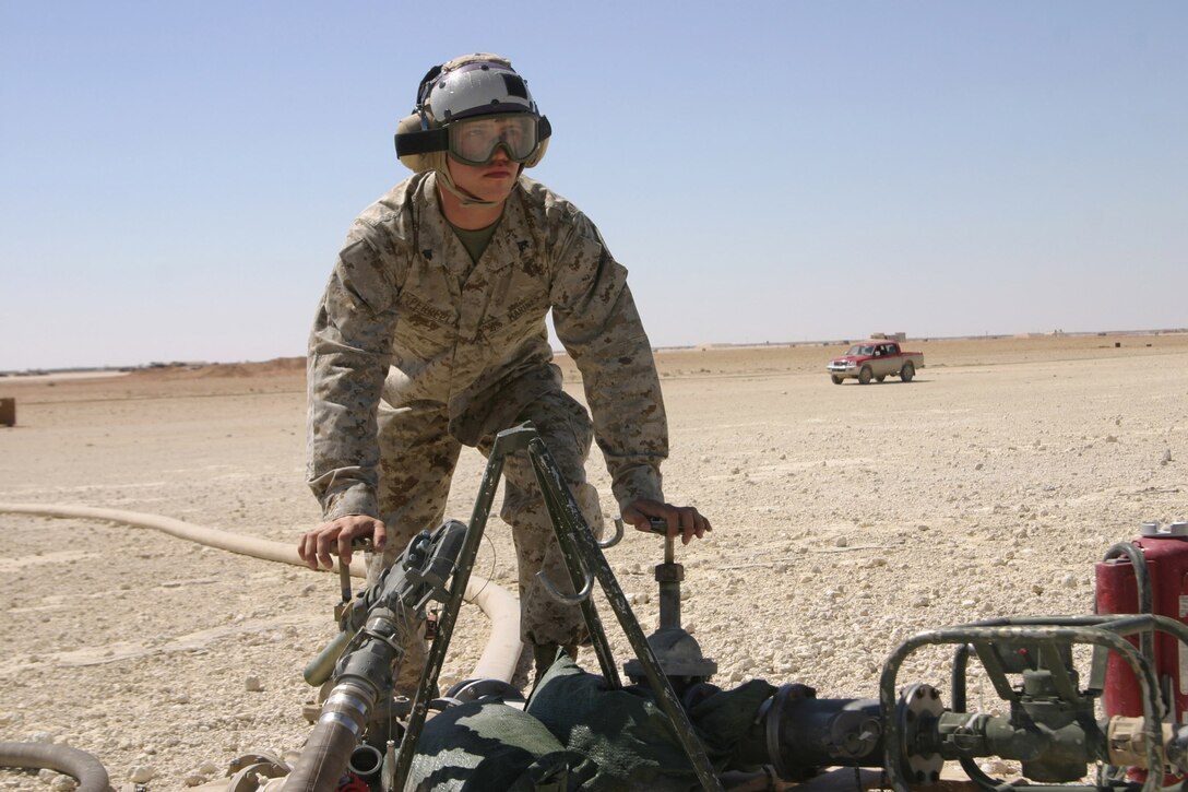 AL ASAD, Iraq- Corporal Joshua Perrella, bulk fuel specialist, MWSS-271 turns off the fuel valves after fueling another aircraft here. Perrella is one of 18 augments from Marine Wing Support Squadron 273 to MWSS-271 for this deployment.