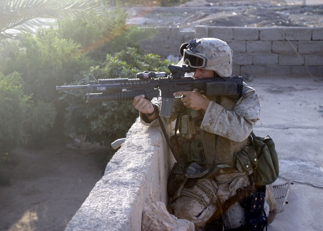 Karabilah, Al Anbar, Iraq (June 18, 2005)-- Cpl. Jared C. Althouse, a 24-year-old Columbus, Ohio native and fireteam leader with 2nd platoon, Lima Co., 3/25 provides security for his squad in Karabilah during Operation Spear. (Official USMC Photo by Corporal Ken Melton)