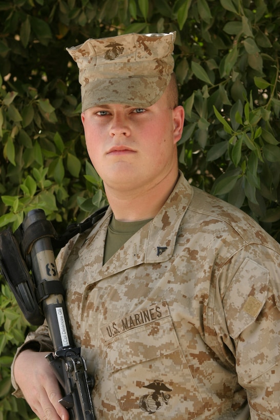 CAMP BLUE DIAMOND, AR RAMADI, Iraq - Lance Cpl. Chase Delancey is a tactical data network specialist with the 2nd Marine Division, dedicated to being one of a handful of Marines who create, maintain and troubleshoot the network that links the Marines in the combat operations center here to the information highway.  U.S. Marine Corps photo by Sgt. Stephen D'Alessio (RELEASED)