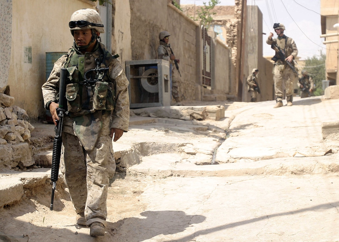 Hit, Al Anbar, Iraq (August 3, 2005)--Hospital man 3rd Class Chan Vang, 32, of Minneapolis, Minn., native, patrols with a squad of Marines from Company "I", 3rd Battalion, 25th Marine Regiment. (Official USMC Photo by Corporal Ken Melton)