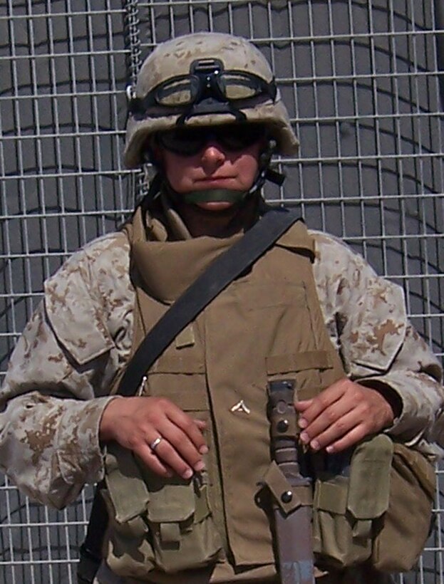 CAMP FALLUJAH, Iraq -- Lance Corporal Girouard deployed here for Operation Iraqi Freedom nearly three months ago from her home station at Camp Lejeune, N.C.  As an 'admin' clerk, she spends a lot of time behind a computer screen or shuffling paperwork.  But as an asset to the infantry, she helps fight back the insurgency.