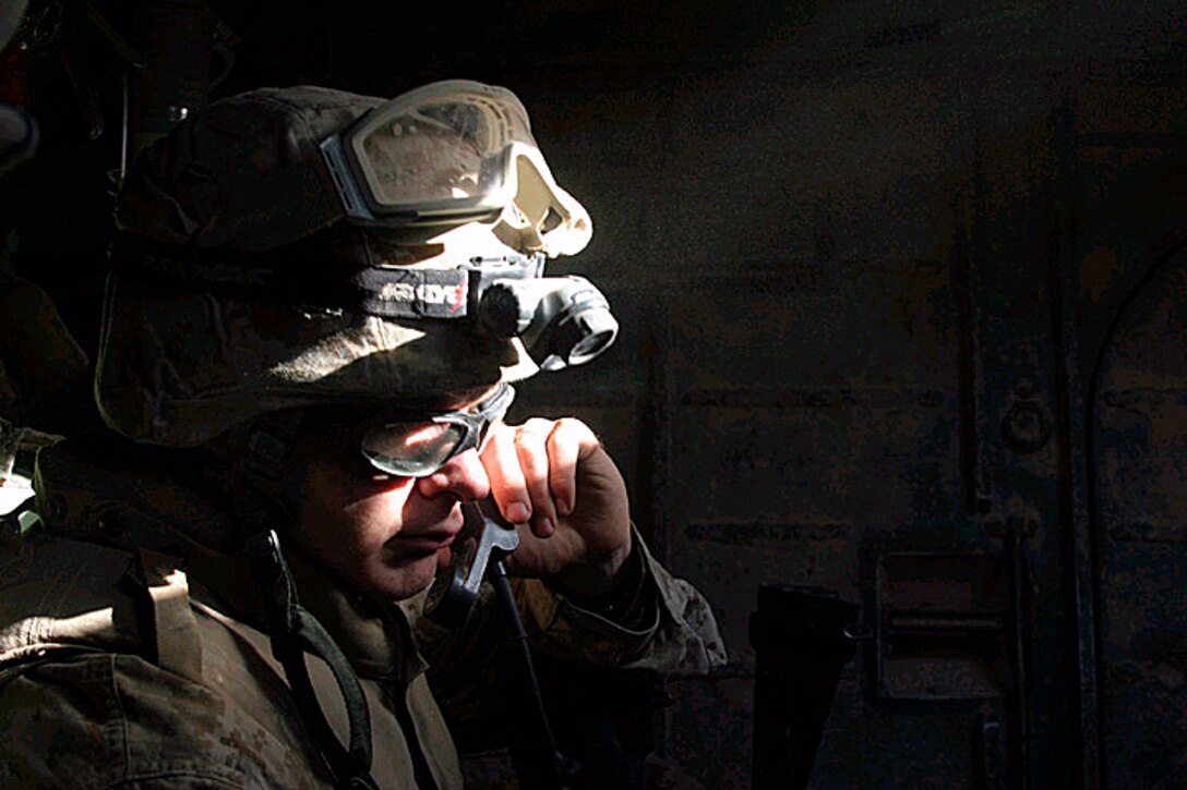 Cpl. Jacob West rides in an Amphibious Assault Vehicle during operations in the Thar Thar Lake area of Iraq on June 18, 2005. The 2nd Marine Division and Multi-National Force-West are conducting counter-insurgency operations with Iraqi Security Forces to isolate and neutralize anti-Iraqi forces, support the continued development of Iraqi Security Forces, and to support Iraqi reconstruction and democratic elections in order to create a secure government that enables Iraqi self-reliance and self-governance. West is assigned to Company B, 1st Battalion, 6th Marine Regiment.