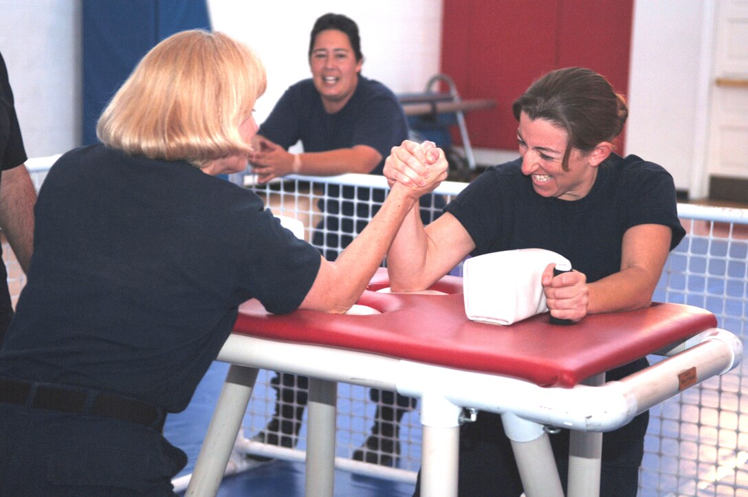 Coast Guard Petty Officer 3rd Class Marcy Stone clenches her teeth in a face off against Coast Guard Chief Petty Officer Teresa Hass. Spectators cheered them on.