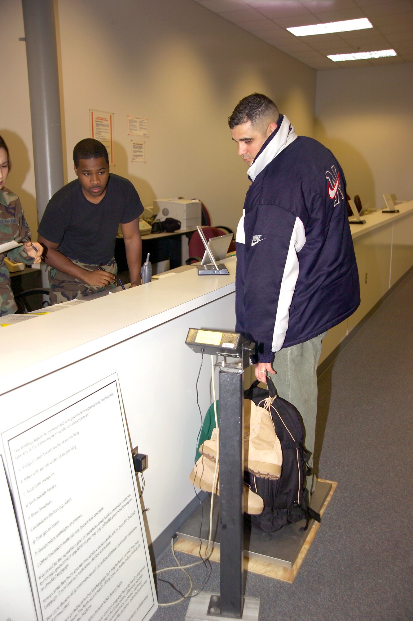 WHITEMAN AIR FORCE BASE, Mo. -- Airman 1st Class Willie Williams weighs Senior Master Sgt. Luke Brito of the 55th Mission Support Squadron from Offutt Air Force Base, Neb., as part of his deployment processiong.  The aggregation is an experimental mobility concept set up by U.S. Central Command Air Force officials to establish a centralized point to provide better support for deploying Airmen. Airmen Williams is assigned to the 509th Logistics Readiness Squadron.  (U.S. Air Force photo by Airman 1st Class Lauren Padden)
