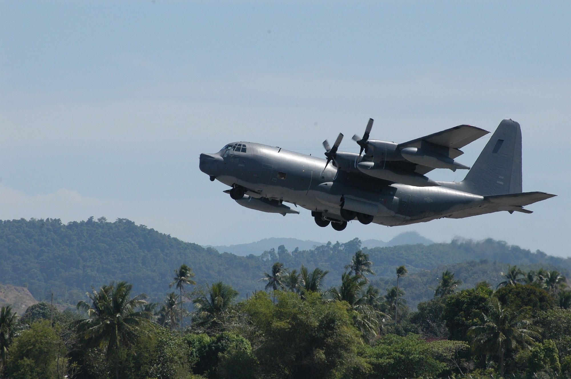 LANGKAWI, Malaysia -- An MC-130P Combat Shadow from Kadena Air Base, Japan, takes off from here Jan 14.  Crews from Kadena's 17th Special Operations Squadron fly into Indonesia daily, shuttling humanitarian relief supplies into Banda Aceh.  (U.S. Air Force photo by Master Sgt. Michael Farris)
