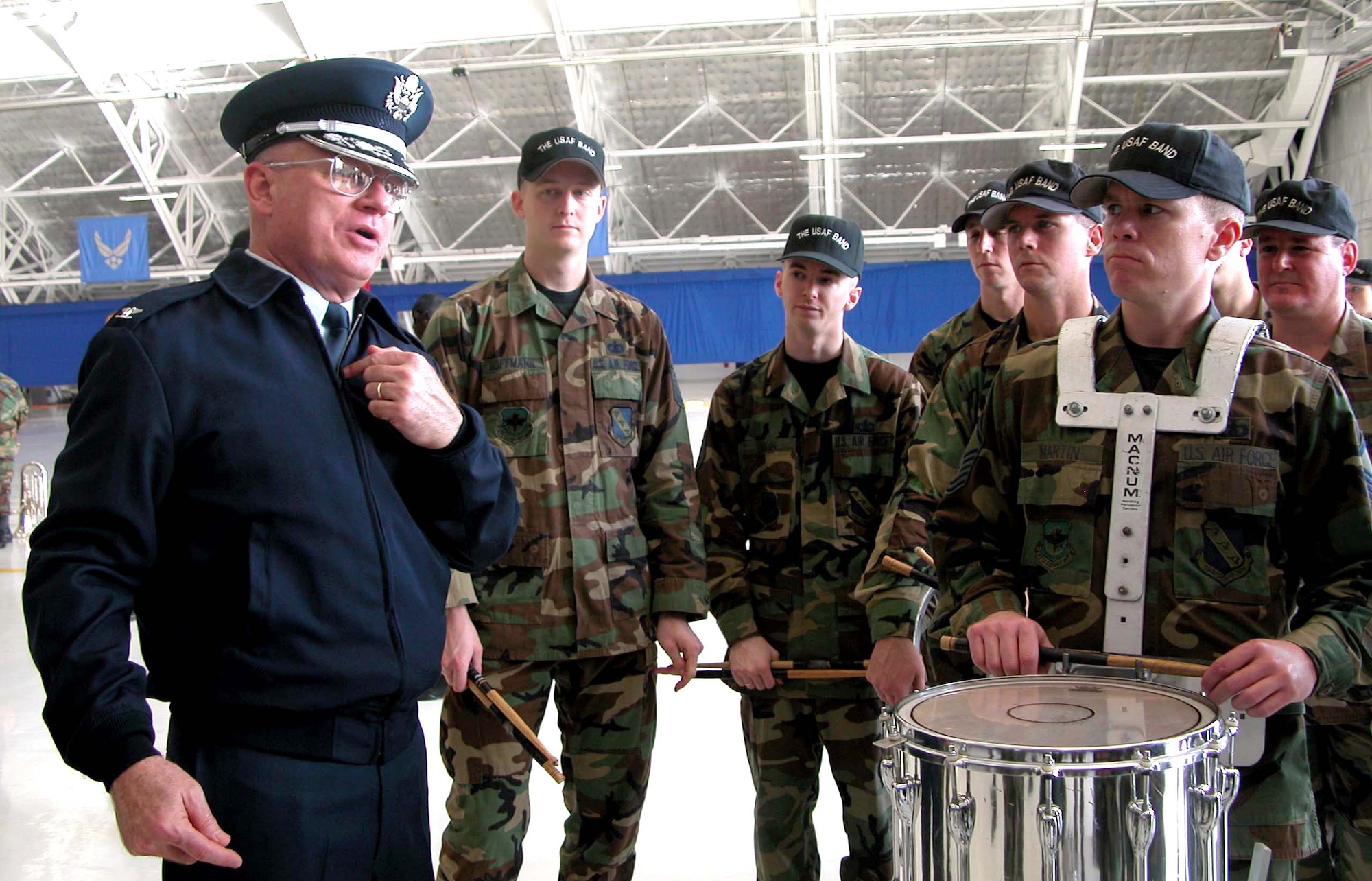 ANDREWS AIR FORCE BASE, Md. -- Col. Dennis Layendecker talks with members of his drum corps after practice here Jan. 13.  Colonel Layendecker will lead the band down Pennsylvania Avenue during the president's inauguration Jan. 20.  He is the commander and music director for the U.S. Air Force Band based at Bolling Air Force Base, D.C.  (U.S. Air Force photo by Army Sgt. 1st Class Doug Sample)
