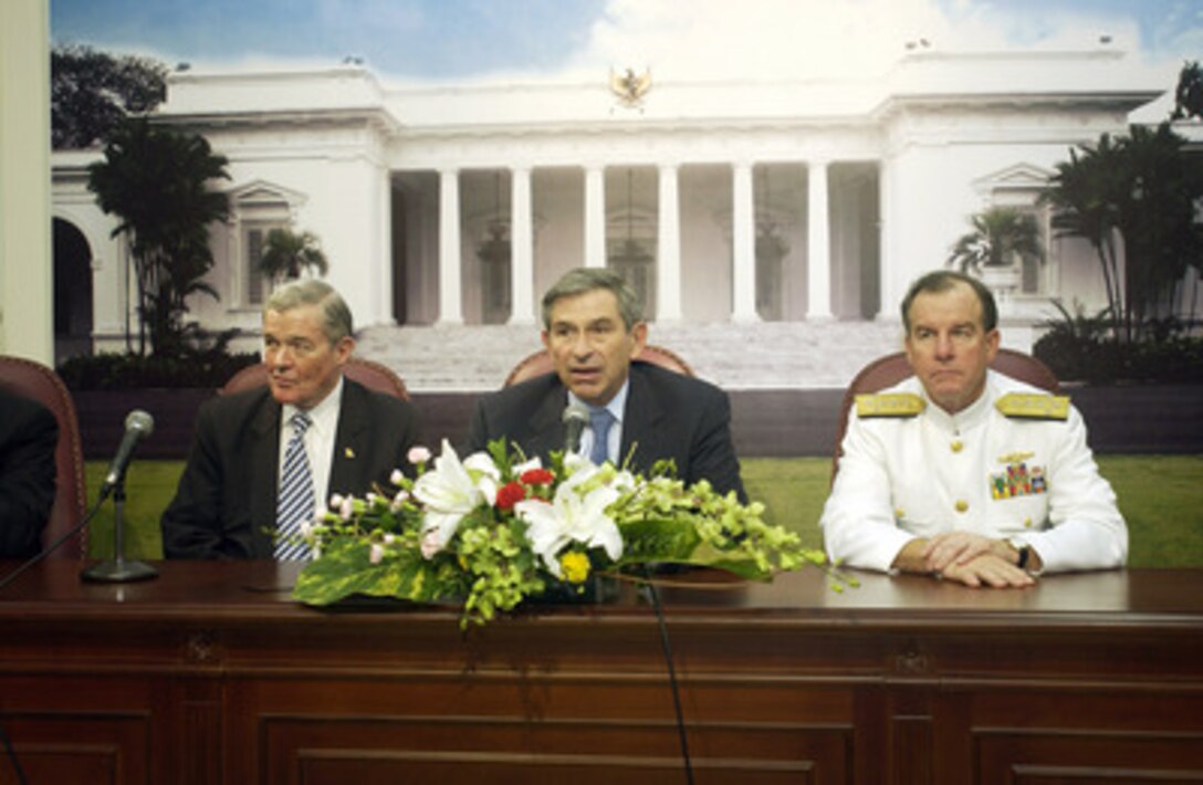 Deputy Secretary of Defense Paul Wolfowitz (center) responds to a reporter's question during a press conference with Senator Kit Bond of Missouri (left) and Commander, U.S. Pacific Command Adm. Thomas Fargo in Jakarta, Indonesia, on Jan. 16, 2005. Wolfowitz is in Jakarta to meet with Indonesian officials concerning U.S. relief efforts. 