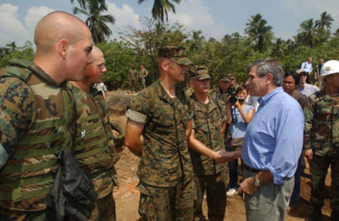 Deputy Secretary of Defense Paul Wolfowitz meets with U.S. Marines handling relief supplies at Galle, Sri Lanka, on Jan. 17, 2005. Wolfowitz is in Galle to meet regional commanders and thank the U.S. service men and women who are providing humanitarian assistance to areas devastated by the Dec. 26, 2004, Indian Ocean tsunami as part of Operation Unified Assistance. 