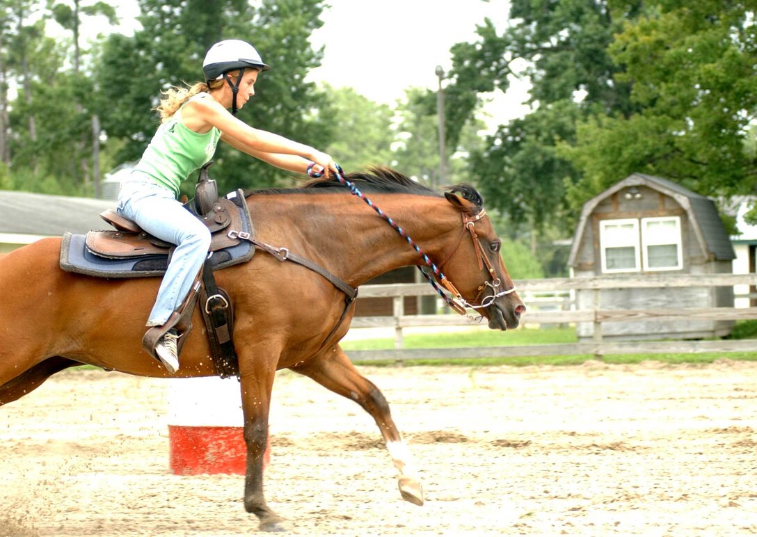 Jordan Davidson, a member of the Scarlett and Gold Riding Club, rides competitively with her horse Poco at the base stables