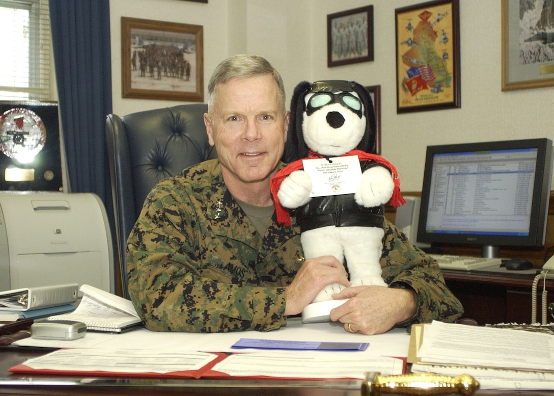 MARINE CORPS BASE CAMP LEJEUNE, N.C. -- Lieutenant Gen. James F. Amos, commanding general, II Marine Expeditionary Force, takes time out to smile with Snoopy.