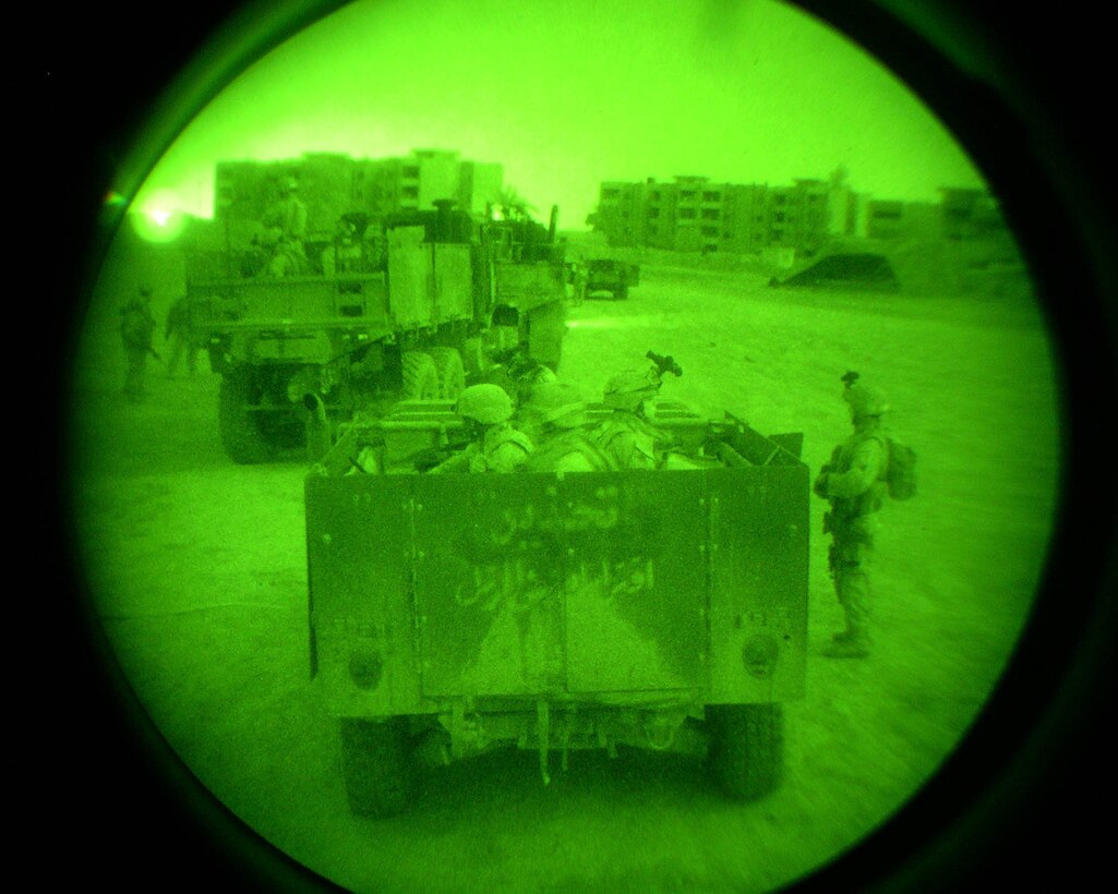 FALLUJAH, Iraq - Marines from Company C, 1st Battalion, 6th Marine Regiment prepare to leave their base of operations to conduct a raid here April 19.  Company C personnel worked alongside Iraqi Security Forces during this operation, and confiscated illegal munitions and more than $40,000 worth of U.S. dollars in dinar.