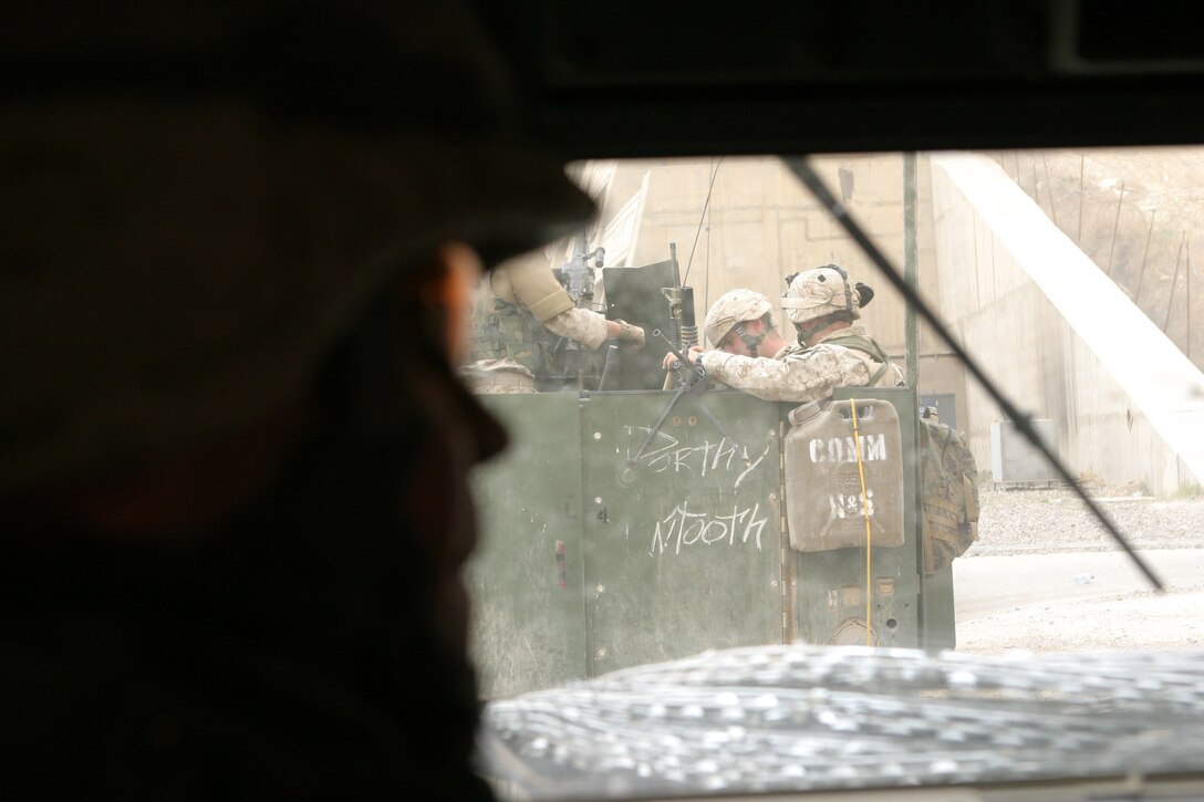 CAMP HADITHAH, Iraq -- Marines with Company L, 3rd Battalion, 25th Marine Regiment climb into their Humvees to search for roadside bombs and mortar positions, April 19.  The search was prompted by a recent mortar attack that hit the dam.  Two Iraqis were found with a rifle, explosives and bomb making material.  U.S. Marine Corps photo by Sgt. Stephen D'Alessio (RELEASED)