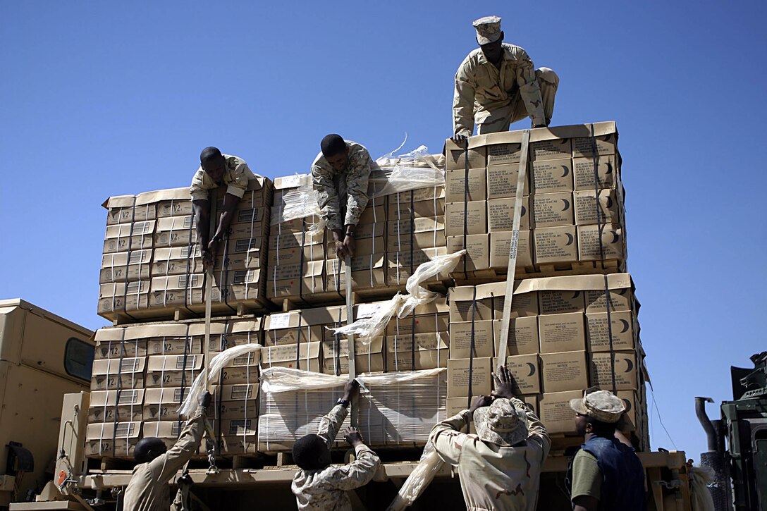 Haditha Dam, Al Anbar, Iraq (May 6, 2005)-- Mississippi natives part of 3rd Battalion, 25th Marines' motor transport section help unload the resupply here.(Official USMC Photo by Corporal Ken Melton)