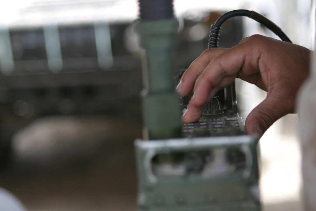 CAMP  BLUE DIAMOND, AR RAMADI, Iraq - Corporal Eddy Salamanca, a 21-year-old Modesto, Calif. native and field radio operator sets up a PRC-119 radio, May 18.  Salamanca is a 2001 graduate of Ceres High School. U.S. Marine Corps photo by Sgt. Stephen D'Alessio