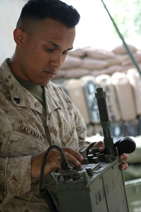 CAMP BLUE DIAMOND, AR RAMADI, Iraq -- Corporal Eddy Salamanca, a 21-year-old Modesto, Calif. native and field radio operator sets up a PRC-119 radio, May 18.  Salamanca is a 2001 graduate of Ceres High School.  U.S. Marine Corps photo by Sgt. Stephen D'Alessio (RELEASED)