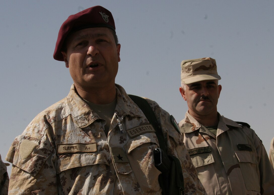 Hadithah, Al Anbar, Iraq.-- Brig. Gen. Satta addresses the Azerbaijani formation on the open-air deck of Hadithah Dam.  He related to Europe's long struggle for democracy and stability.  Stressing that national infrastructure is a crucial part of reconstruction, Satta told the Azerbaijanis to be proud of the job they are doing in Hadithah.  (Photo by Lance Cpl. Marc Fencil. )