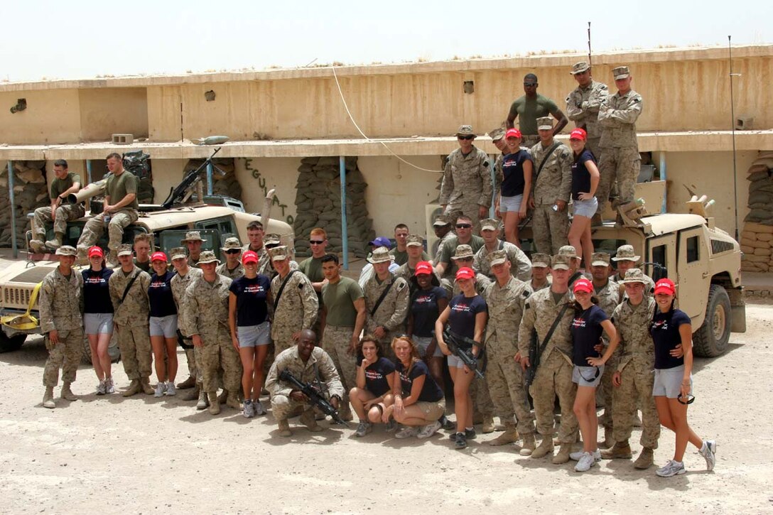 CAMP FALLUJAH, Iraq -- The Arizona Cheerleaders visited all the units at Camp Fallujah during their time here, including Weapons Company, 3rd Battalion, 8th Marine Regiment.  They took many group and individual photos with all the different units they visited.  Official U.S. Marine Corps photo by Lance Cpl. Athanasios L. Genos