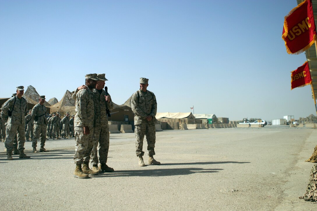 CAMP TAQADDUM, Iraq -- Lietenant Gen. James F. Amos, commanding general of II Marine Expeditionary Force, talks about Brig. Gen. Ronald S. Coleman, a Darby, Pa., native, after Coleman relinquished command of 2d Force Service Support Group to Brig. Gen. John E. Wissler.  “Ron, you’ve done a great job of leading these Marines,” said Amos. “If anyone thinks it was an easy decision for Ron to let his Marines come out here without him; it wasn’t. But knowing they were coming over here with Brigadier General Wissler made it easier for him. He wanted to come out here to do this because he understands the sacrifice.”