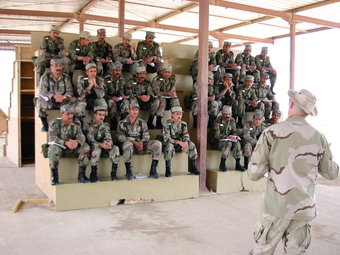 KIRKUSH MILITARY TRAINING BASE, Iraq -- An Air Force professional military education instructor teaches Iraqi students here.  He is one of 28 Air Force instructors deployed to Iraq to train noncommissioned officers of the new Iraqi army.  (Courtesy photo)