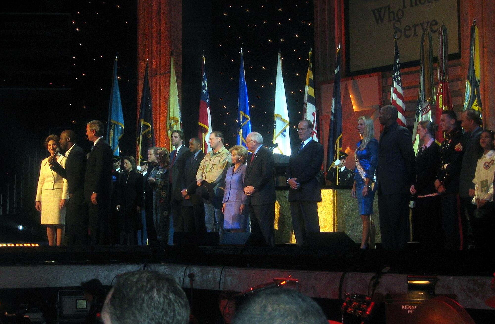 WASHINGTON -- Gospel singer Bebe Winans sings a tribute to President Bush and the U.S. military during the &quot;Saluting Those Who Serve&quot; gala here Jan. 18.  Also on stage are first lady Laura Bush; Vice President Dick Cheney and his wife, Lynne; and a star-studded cast of celebrity performers and entertainers.  (Department of Defense photo by Donna Miles)