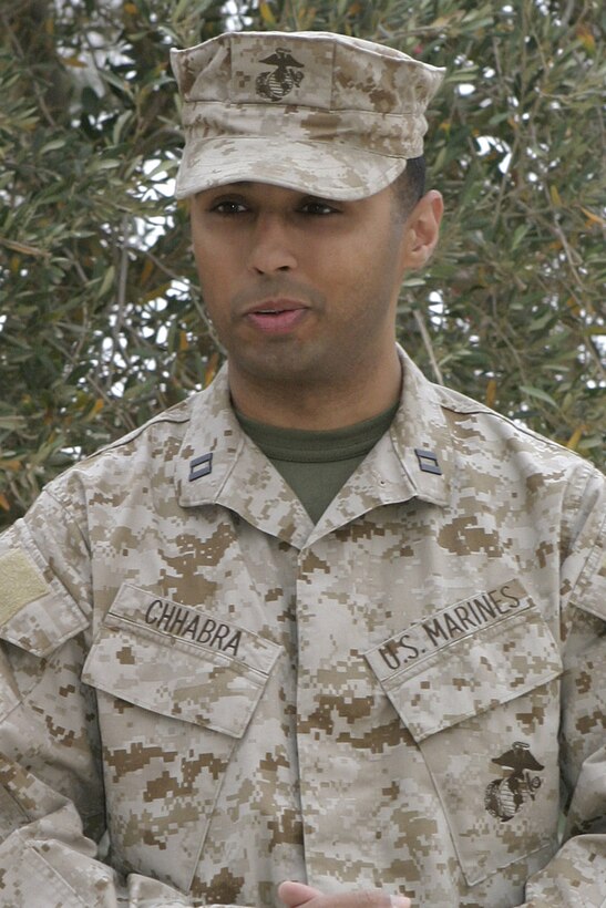 AL ASAD, Iraq -- Captain Tom Chhabra, outgoing commander, addresses the Marines in the company after relinquishing command of Headquarters and Service Company, Provisional Security Battalion.  Chhabra, from West Windsor, N.J., assumed command of the company in February 2004 and said it was a privilege to serve as commanding officer.