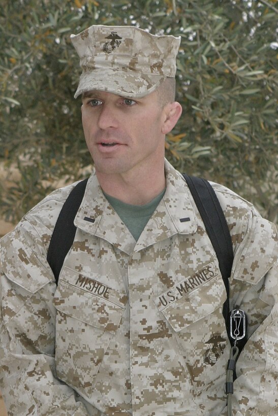 AL ASAD, Iraq -- First Lt. Michael K. Mishoe Jr., incoming commanding officer, addresses the Marines in the company after assuming command of Headquarters and Service Company, Provisional Security Battalion.  Mishoe, from Corning, Calif., comes to the unit from the battalion?s Bravo Company.