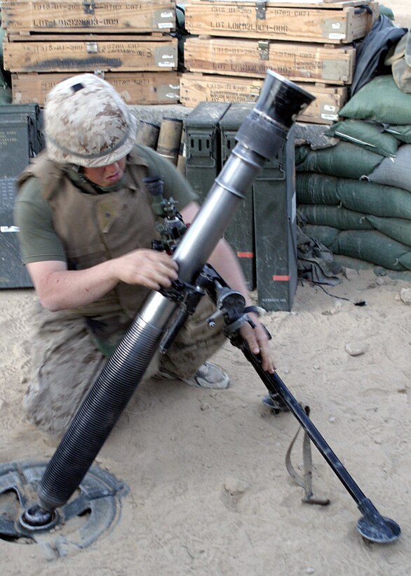 Camp Hit, Al Anbar, Iraq (April 16, 2005)--Pfc. Mark R. Garfold, 22 of Pittsburgh, a mortarman with 3rd Battalion, 25th Marines, prepares to return fire on insurgents who attacked Camp Hit with mortars of thier own. (Official USMC Photo by Lance Cpl. Shane S. Keller)